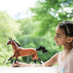 Breyer Traditional Adamek being played with by a little girl