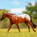 Breyer Traditional Chocolatey on blurred field background
