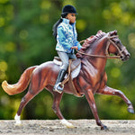 Breyer Traditional Makayla Schooling Rider on top of model horse