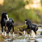 Breyer Traditional Nistar Blazing Kansas LOM and GTF Blazing Ethel on blurred wooded background