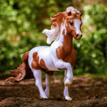 Breyer Traditional Spordur Fra Bergi Model horse in blurred wooded area