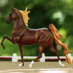 Breyer Traditional WGC Marc of Charm on blurred background in a show ring