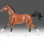 Breyer Traditional Adamek on blurred grey background