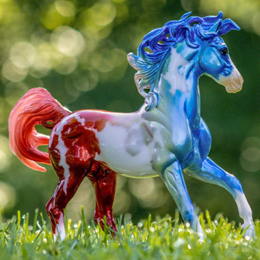 Breyer Traditional Anthem on Blurred Wooded Background