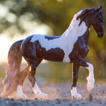 Breyer Traditional Battlefield Angel HP Model horse on Blurred wooded Background at golden hour