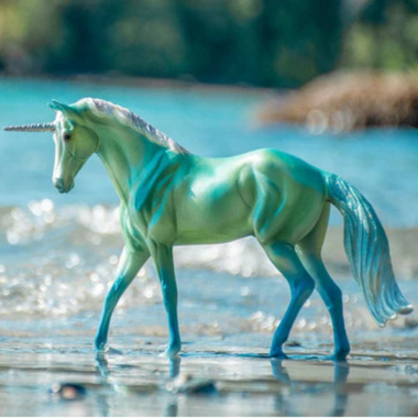 Breyer Freedom Le Mer Unicorn of The Sea on Blurred beach scene