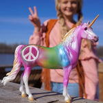 Breyer Freedom Series Keep The Peace on blurred background played with by young girl