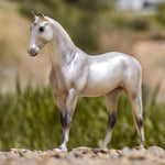 Breyer Freedom Series Pearly Grey Trakehner on blurred mountain background