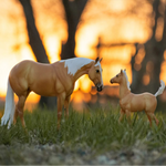 Breyer Traditional Ebony Shines and Charlize Quarter Horse Set on Sunset field background