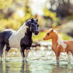 Breyer Traditional The Phantom and Misty Gift Set on blurred wooded water background